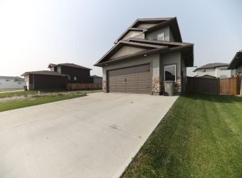 concrete driveway with garage