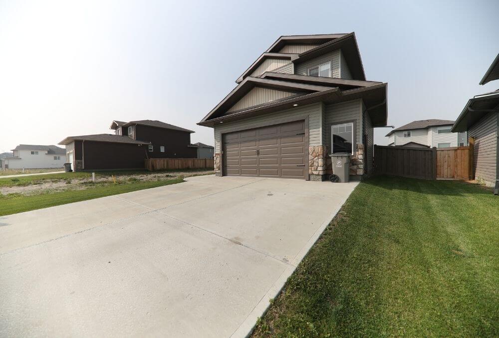 concrete driveway with garage